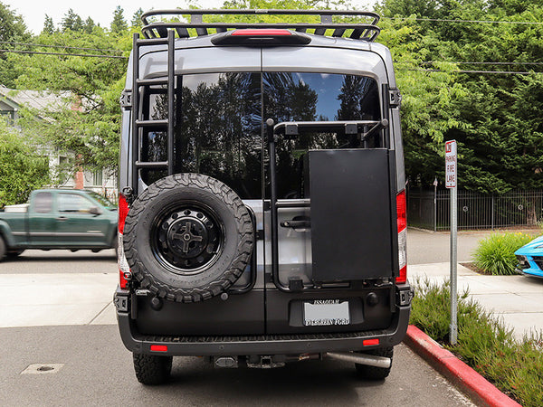 Transit tire rack and ladder combo with fold out bottom steps - Driver side